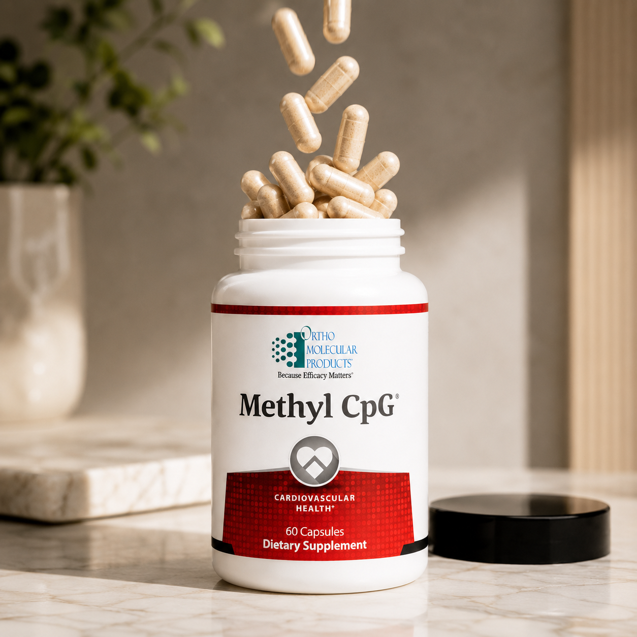 A white bottle of dietary supplement with beige capsules falling out of the open top, set on a marble surface with a blurred indoor background.