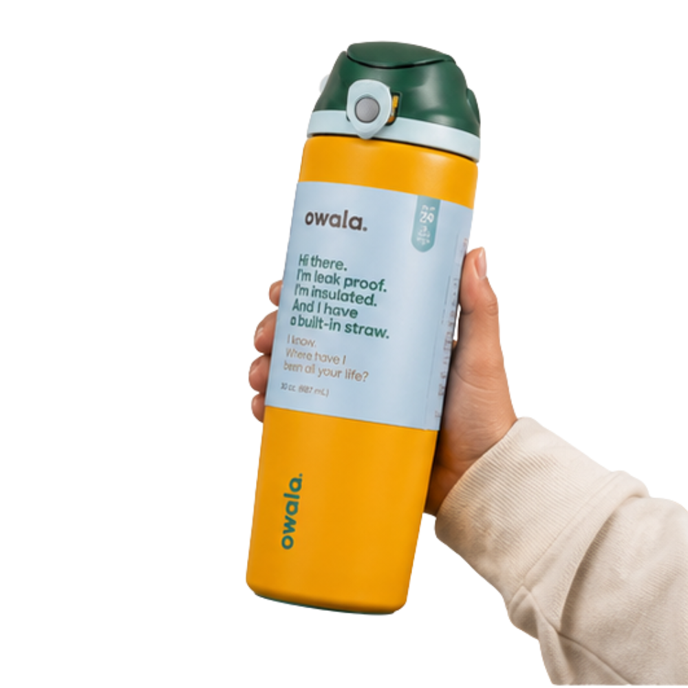 A hand holding an Owala insulated water bottle with a yellow body, dark green cap, and light blue label, shown against a plain white background.